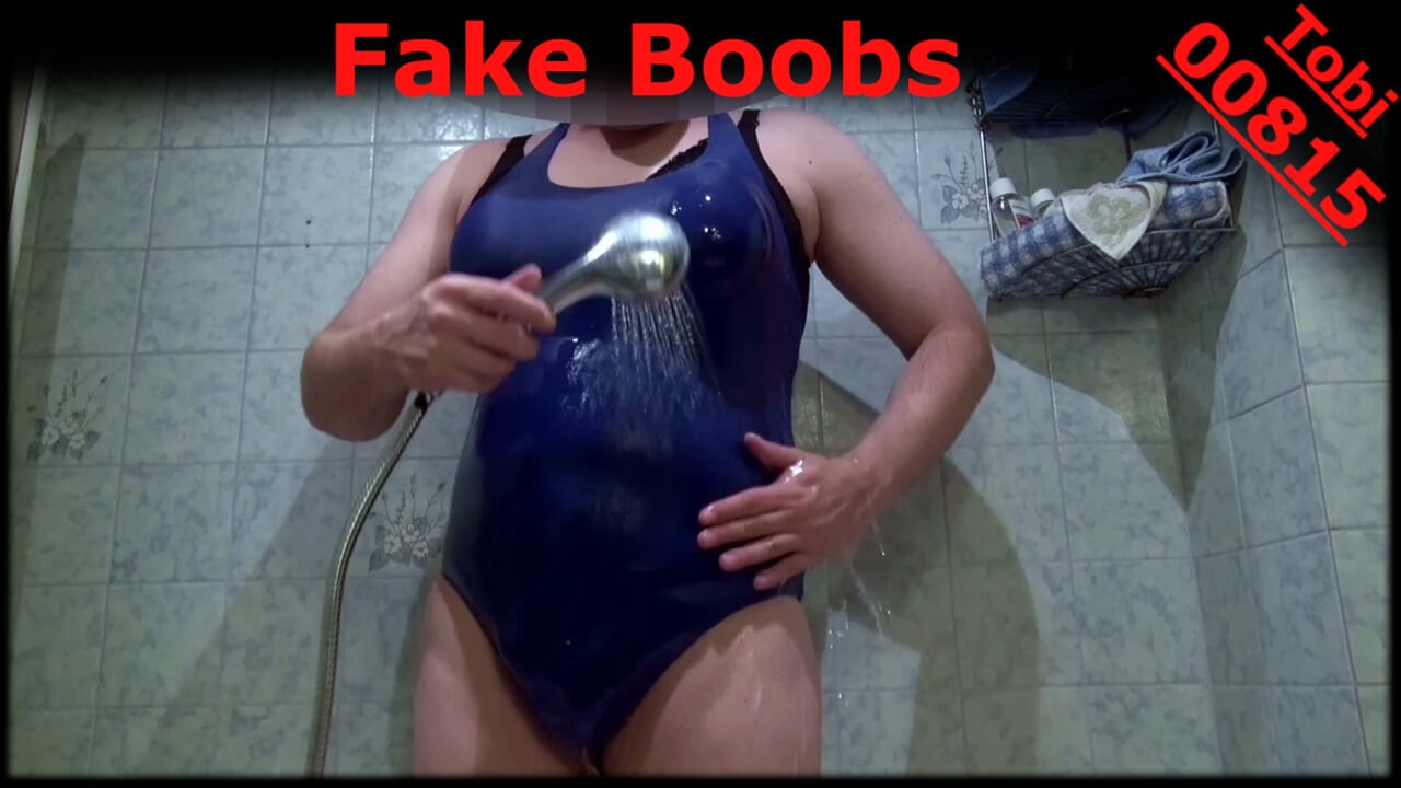 Fake Boobs - some posing in blue swimsuit, shaved body