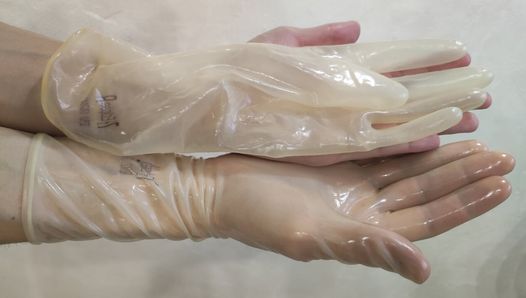 Transparent fetish gloves trying on