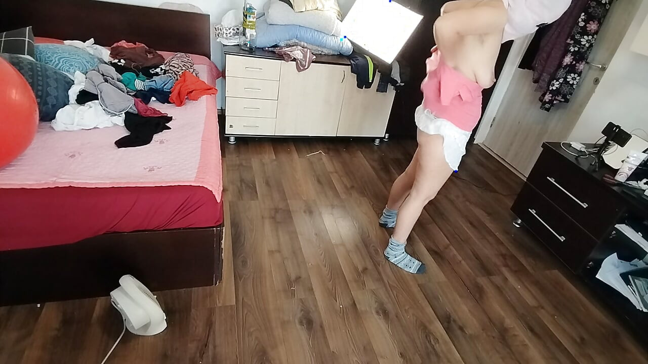 Amateur wife enjoys trying on clothes and cutting them.