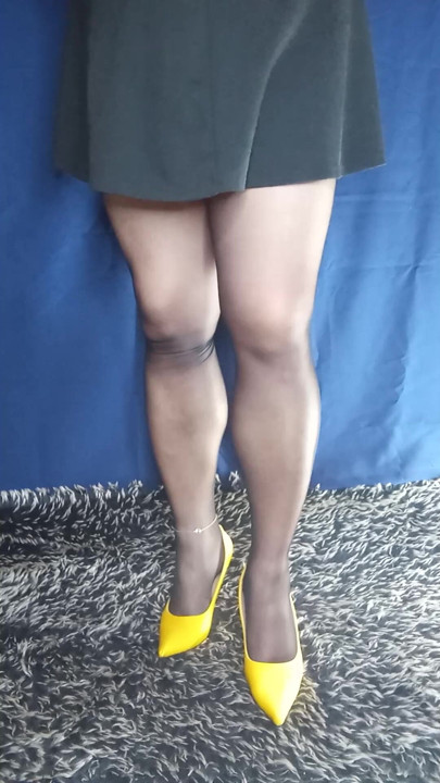 Black pantyhose and high heels with mini skirt