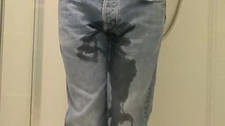 Guy pees in jeans