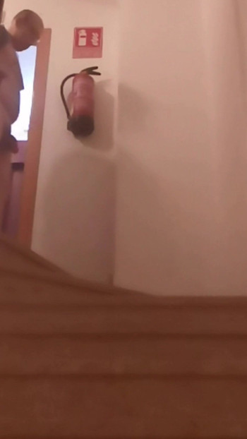 GOING DOWN THE STAIRS OF RESIDENTIAL BUILDING