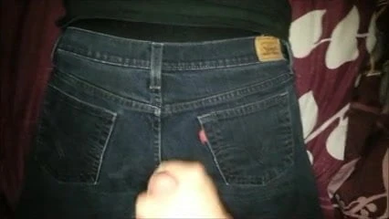 Cumshot on black jeans