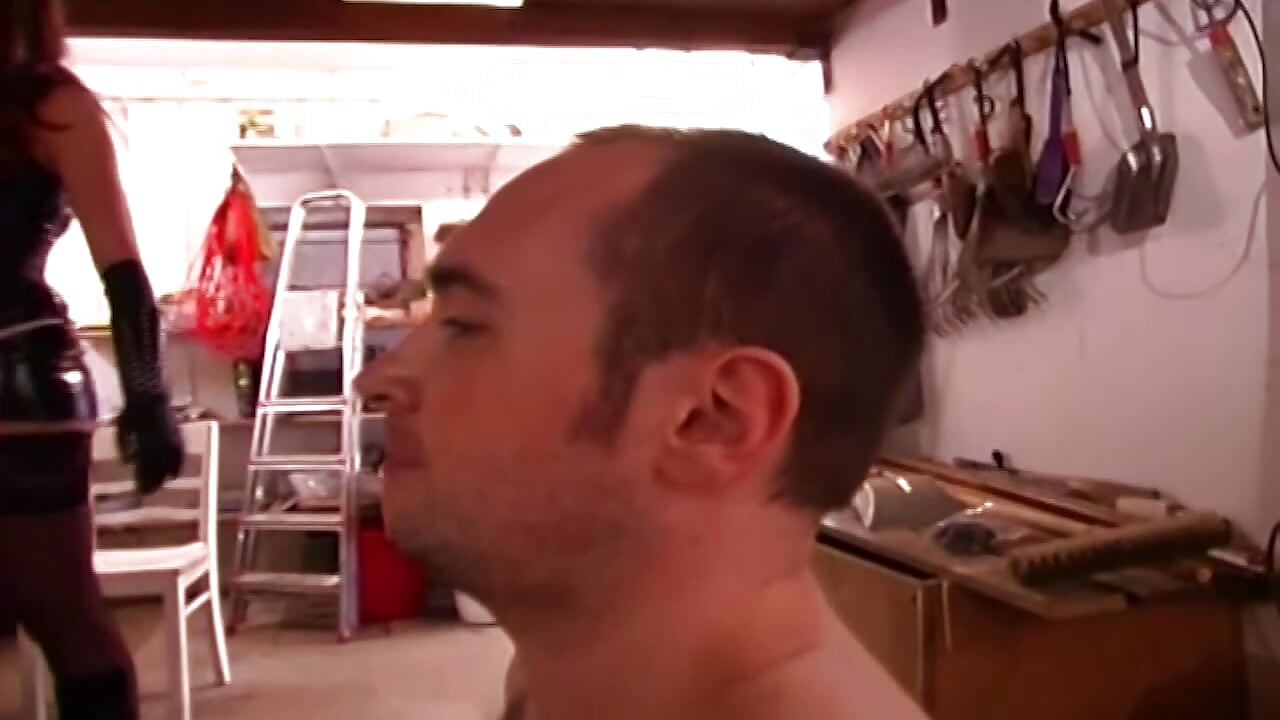 Dominatrix Stretches Submissive Man's Ass Wide in Garage