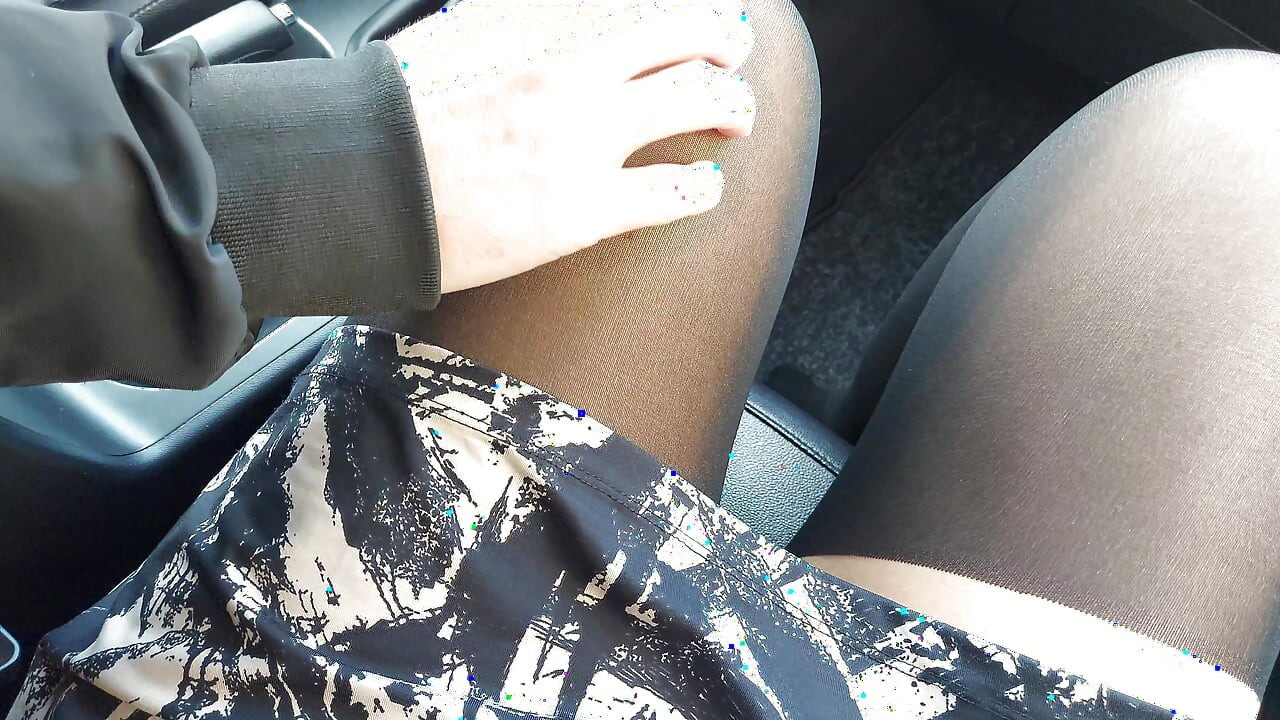 Stylish woman teases taxi driver in the car with her sexy legs