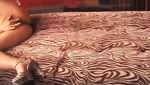 Horny Asian bitch masturbates in bed solo