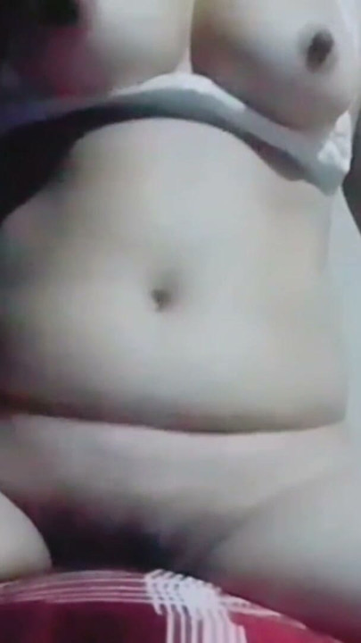 Hot desi bhabhi is masturbating while pressing her boobs and caressing her nipples, she is getting orgasm while caressing her | Clip 1