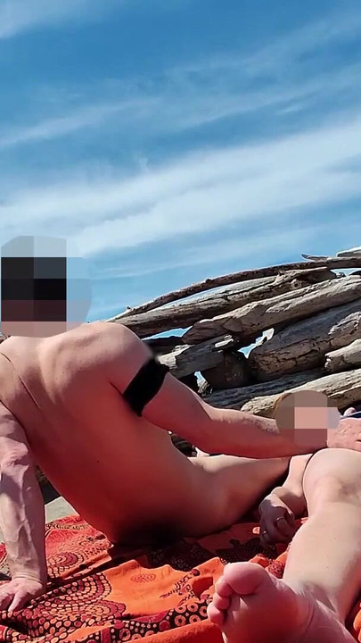 Thrilling moment from "Fingering wet pussy on public beach and gets caught and interrupted by voyeur - MissCreamy"