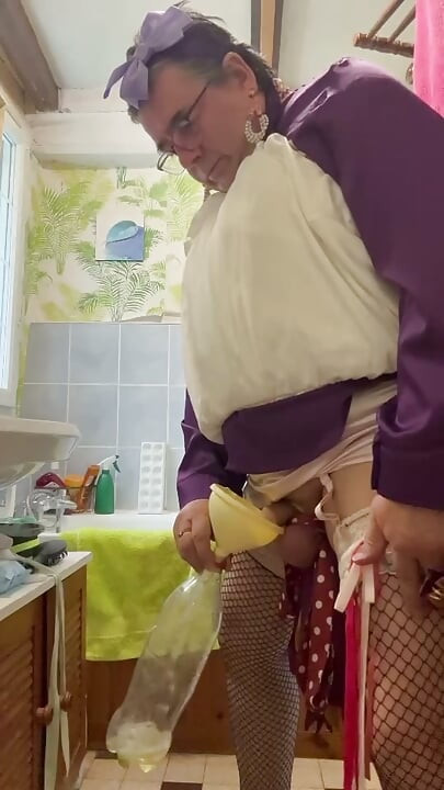 Dressed in a bubble skirt to pee into a bottle