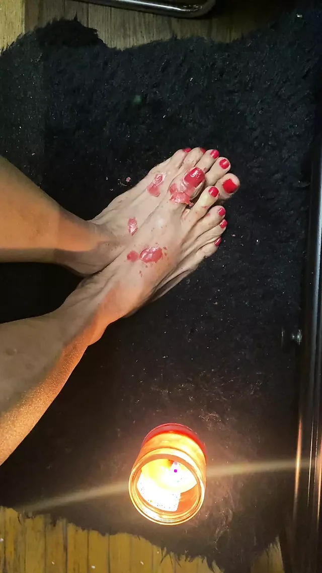 Candle light on tiny feet with sexy toes
