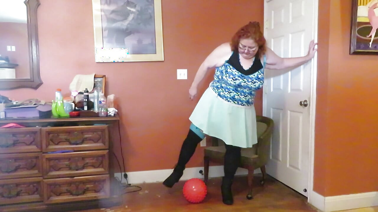 Nurse Vicki  plays with a rubber ball in a mini skirt, sexy stockings and high heel mini boots