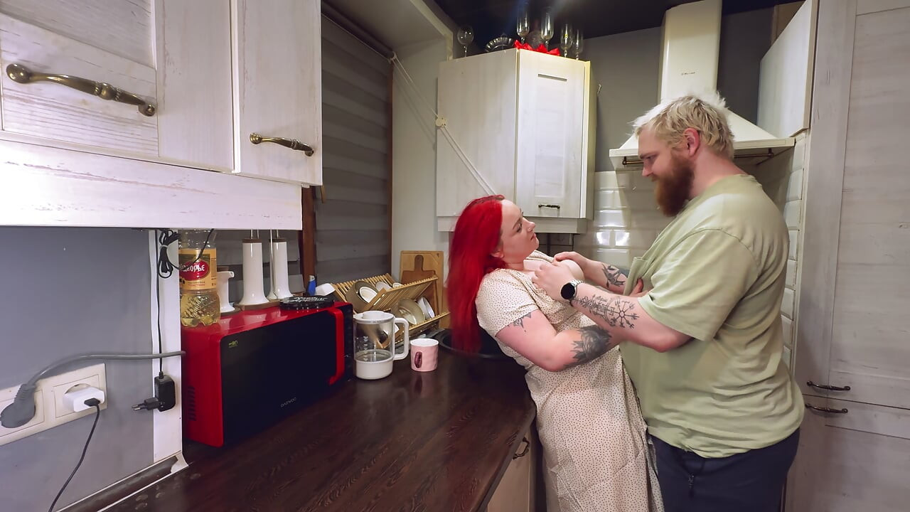 Sex in the kitchen with a red-haired wife. .