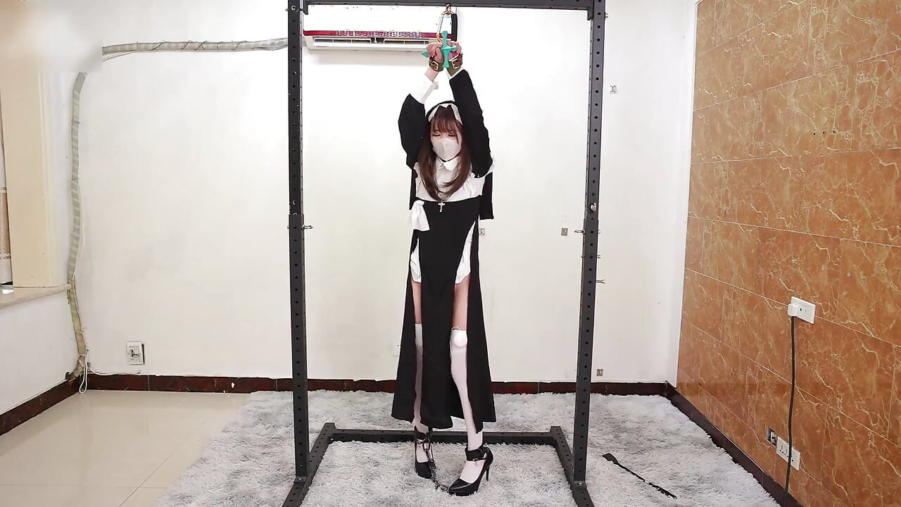 The Girlfriend Role-plays a Nun, Handcuffed and Shackled, Bound to an Iron Frame