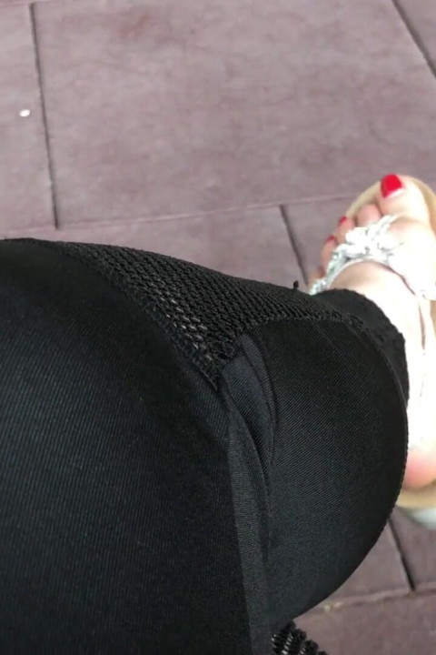 Sandals teasing outdoor with red toenails & toes wiggling