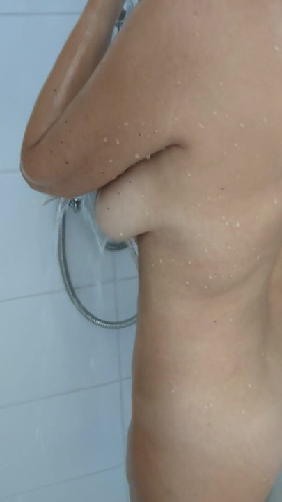 Spectacular moment from "My hot milf wife with big natural tits lets me film her taking a shower and shaving her pussy."