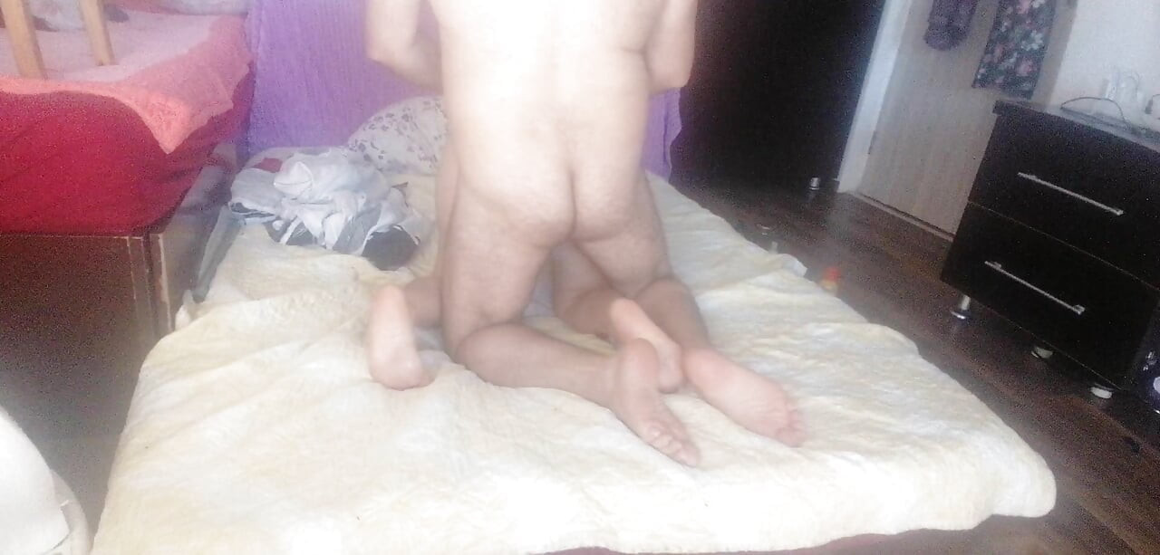 Sensual massage of a hot couple with oil on the body.