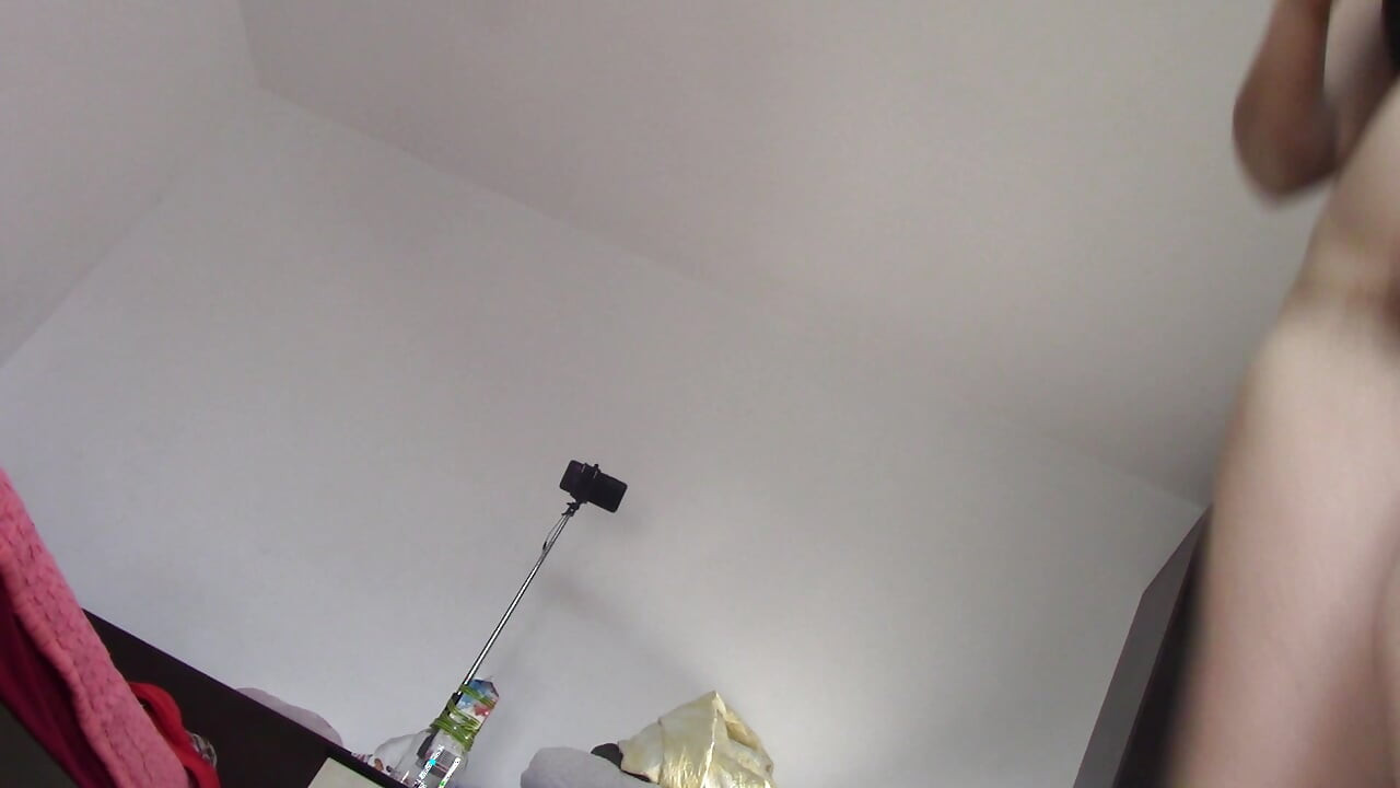 Amateur wife dancing naked at home. Amateur woman has fun trying on clothes and cutting them.