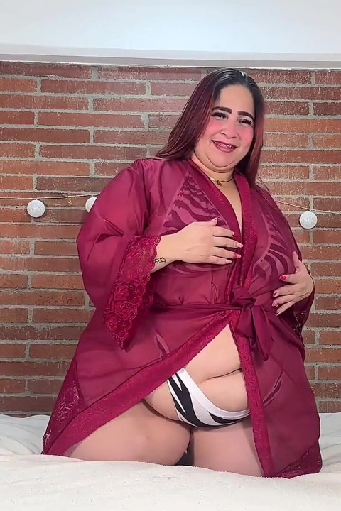 Plus-size Woman with Lush Curves in Zebra Lingerie: Provocative and Sensual in Bed