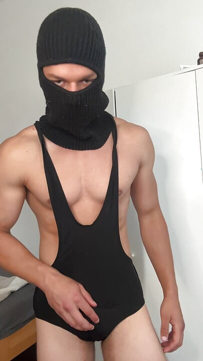 Muscle hunk teasing in a tight singlet