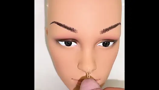 Pissing on a mannequin doll's face