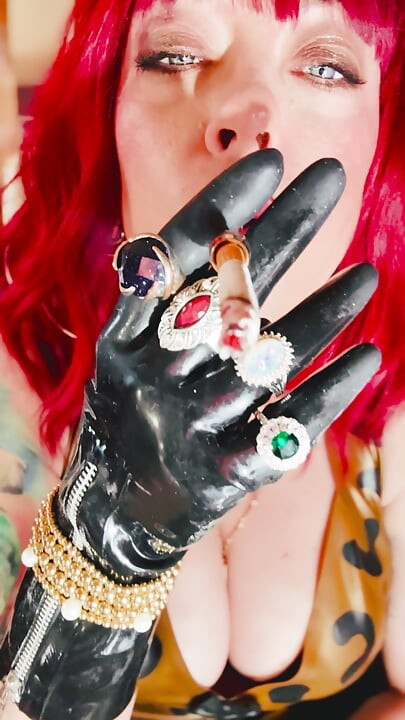 The Beautiful Rubber Beauty Tina Snua Smoking A Cigarette Using A Holder - Smoker Latex Gloves Rings Jewellery