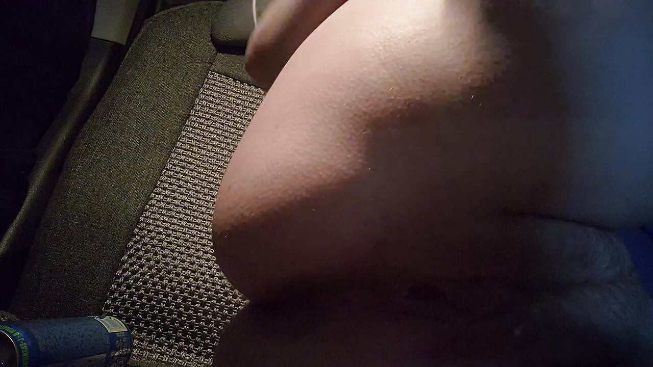 Slut in the evening in the parking lot fucks herself with a can of energy drink in the car