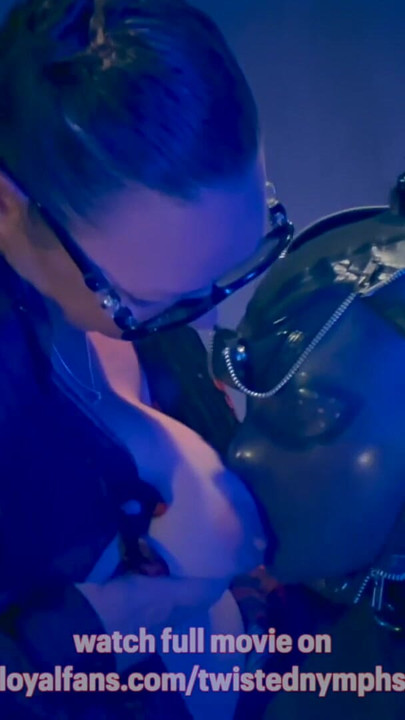 Key moment from "Twisted Nymphs - April full latex dolly"