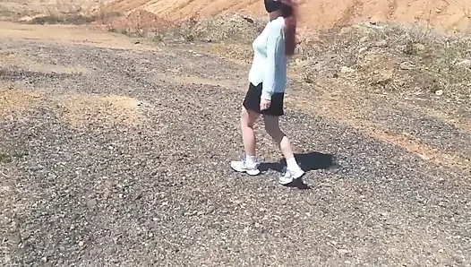 Girl undresses on a windy day