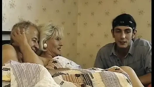 Hairy blonde mature gets spitroasted in a threesome