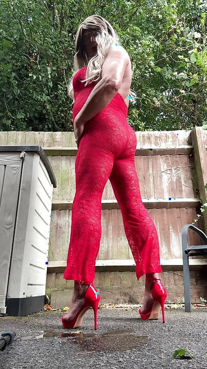 Sexy Crossdresser kellycd2022 in sexy red jumpsuit and heels