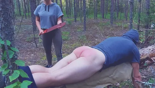 Spanking husband in the forest