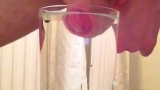 Cumming into a glass of water