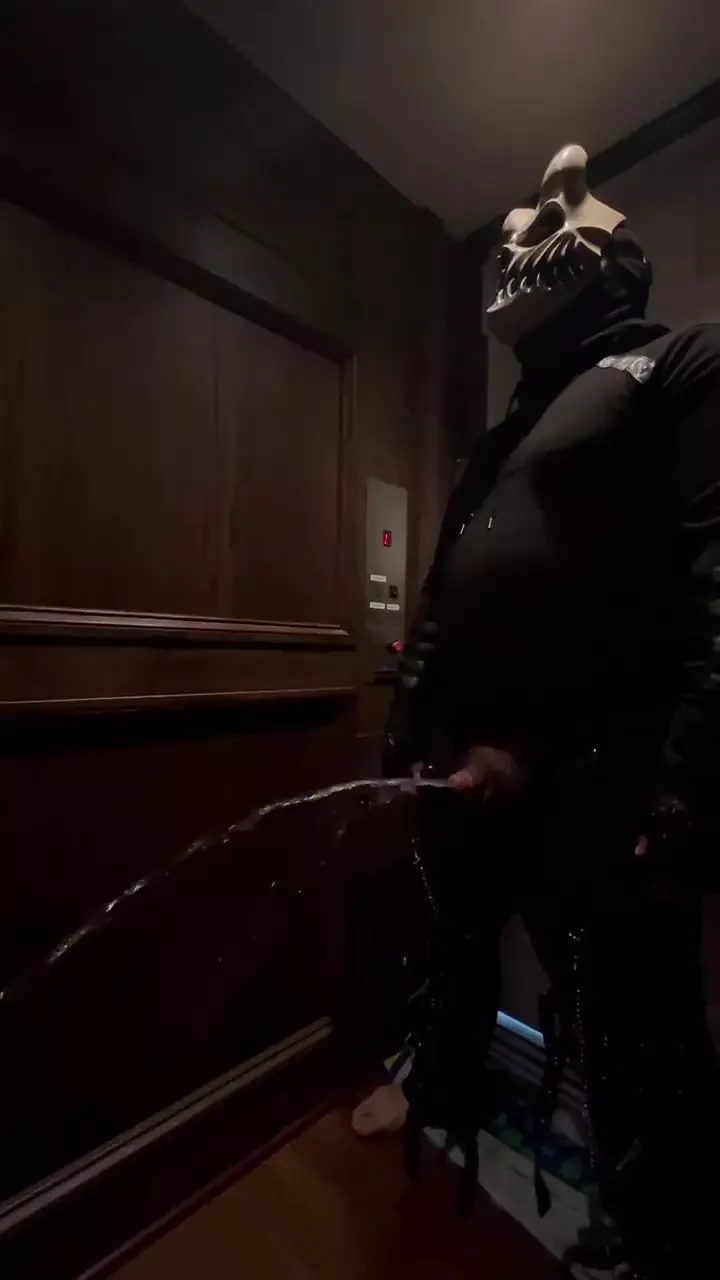 demon having a nice long piss in an elevator
