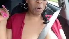 Solo ebony Desiree Desire flashes her tits while driving