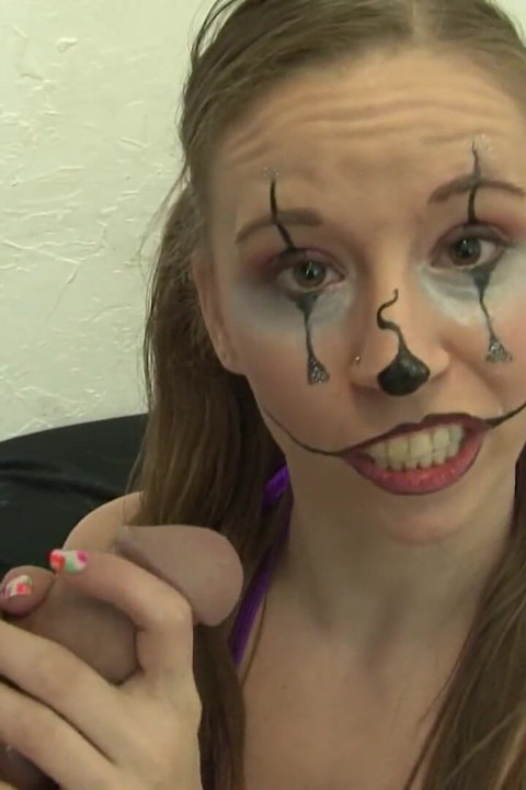Hottie with face color playing with her clown
