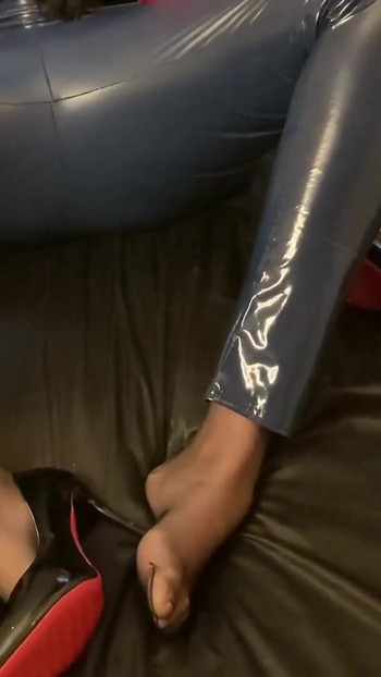 Captivating moment from "Blue Vinyl Leggins, Nylons, High Heel Pumps"