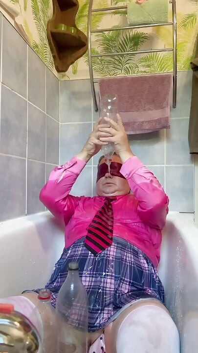 In a schoolgirl outfit to take a piss shower with bottles