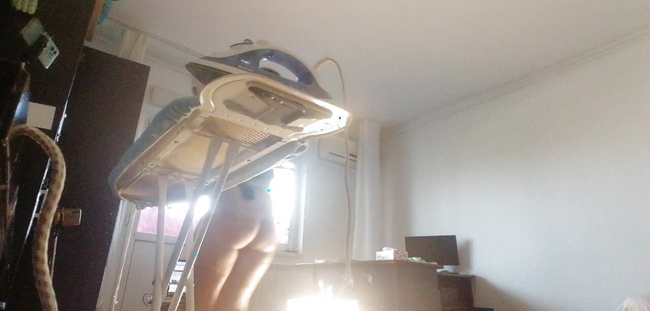 Sexy wife doing housework naked. Brunette, hairy pussy, big ass, big tits. Sexy mom massages herself with a vibrator.