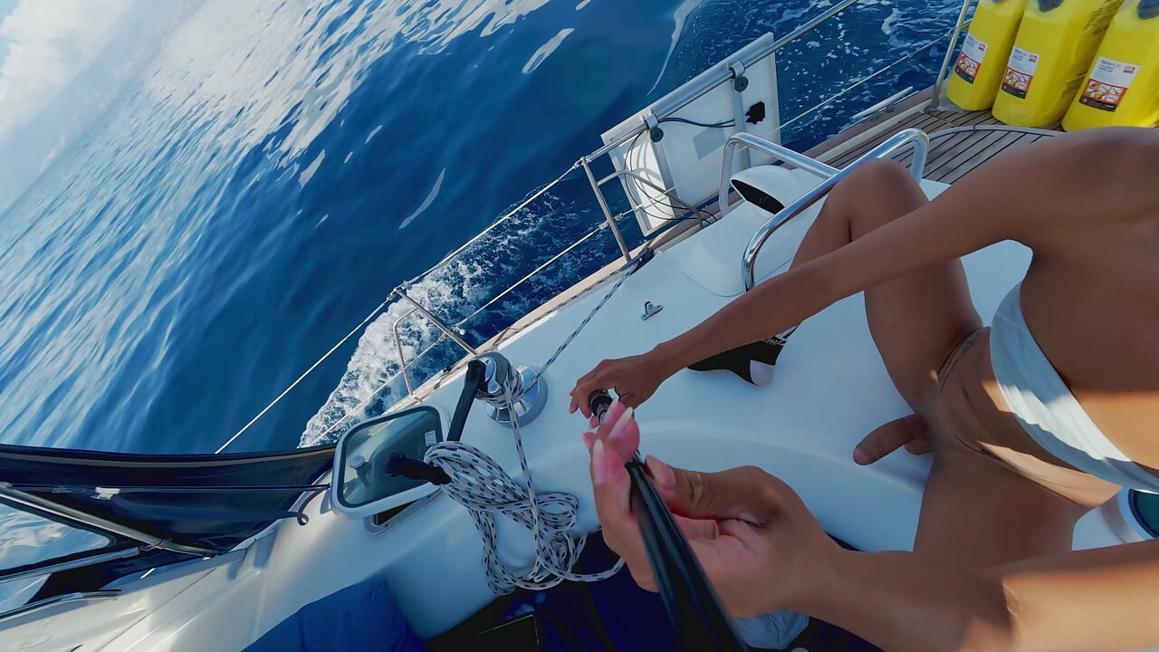 Trans masturbation while sailing and cum shot in the cup inside the boat