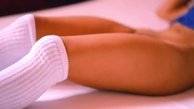 College girl lies down with her roommate on the sofa
