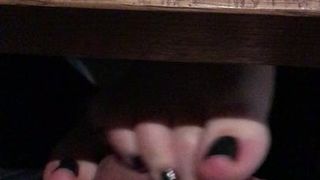 Footjob in restaurant