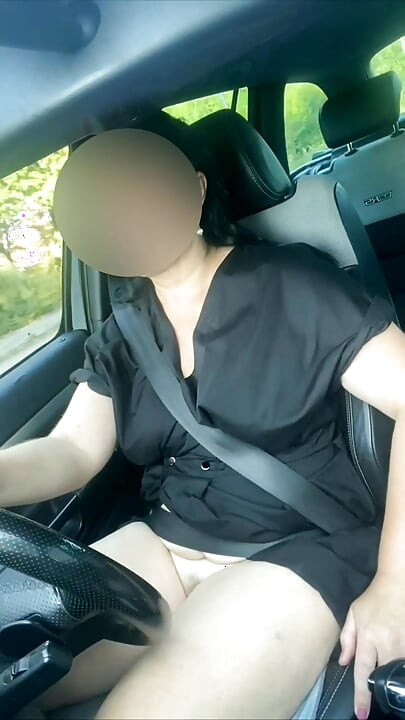 Naked sexy MILF in a car
