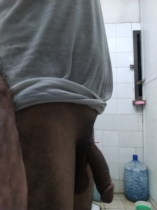 The boy who is messing around with his hands in his home's washroom