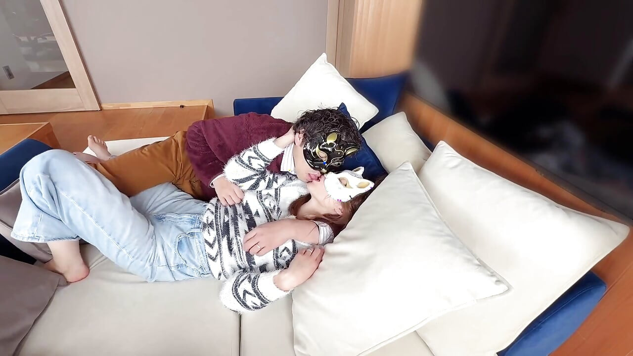 On the Sofa in Their Secret Room, They Shared Passionate Kisses Before Making Love, Expressing Their Deep Love.