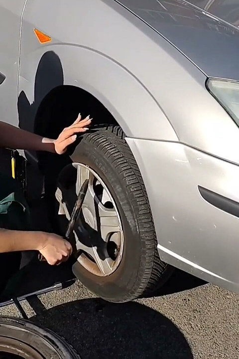 Dirndl Slut Gets Dirty and Oily Changing Tires