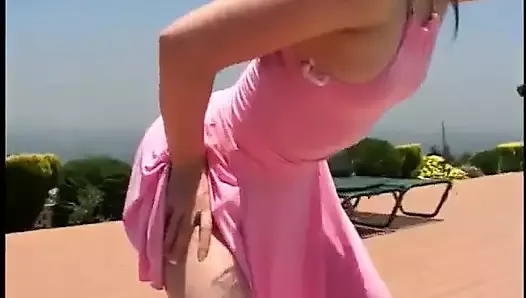 Leggy chick in pink dress is anal fucked with one leg stepped up on hotel bed