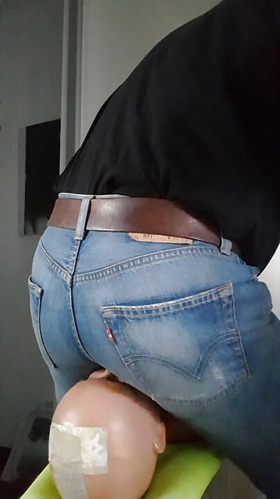 My jeans-butt riding the face of my sitting-doll