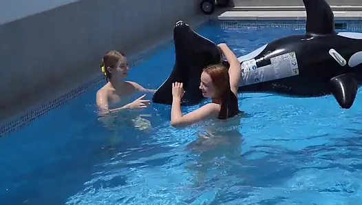Lesbian Girls Are Having Fun in a Pool with an Inflatable Shark