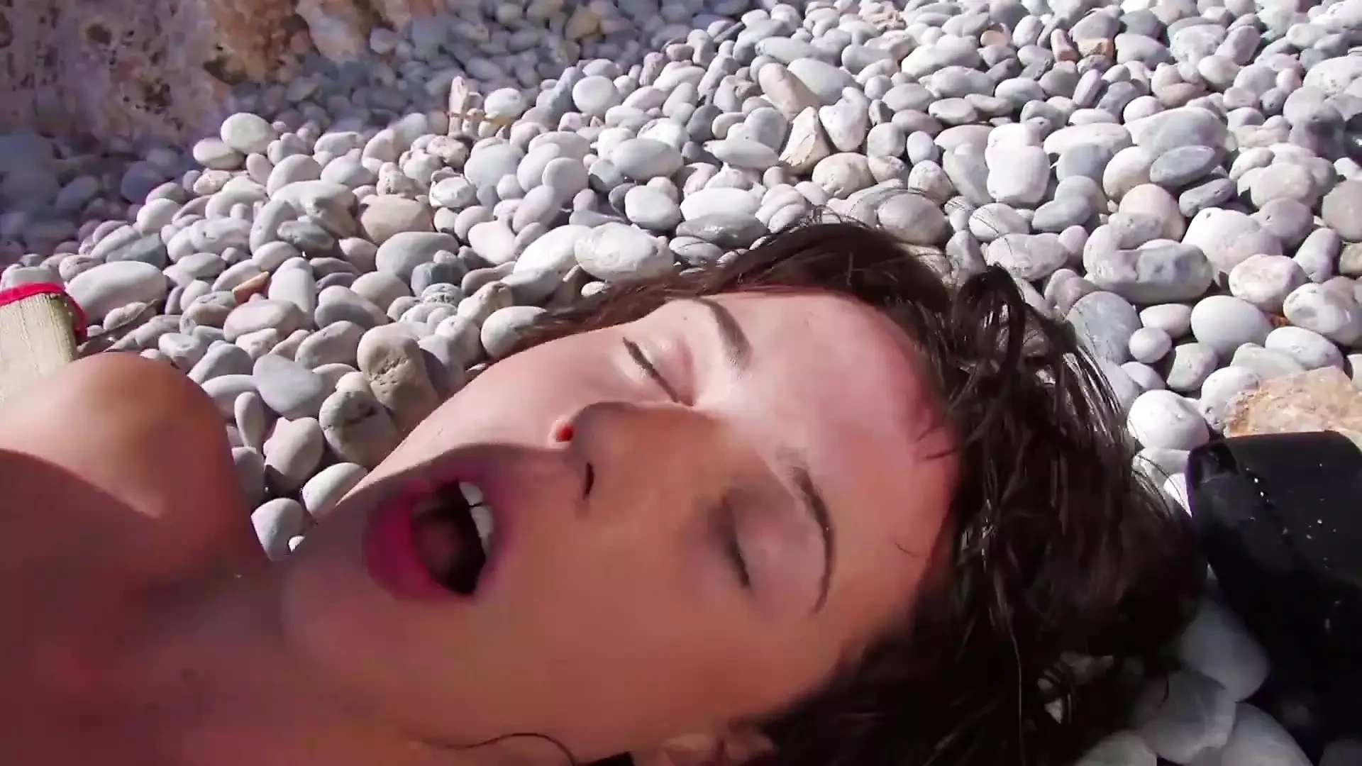 Beautiful brunette gets pussy and ass drilled at the beach