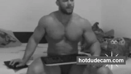 Sexy hunk alone in his bedroom